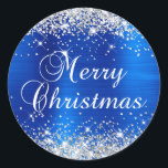 Glittery Silver and Royal Blue Merry Christmas Classic Round Sticker<br><div class="desc">Fancy calligraphy Merry Christmas envelope seal stickers for your special holiday greetings or invite.
Girly faux sparkly silver glitter on the top and bottom edge over a faux royal blue brushed metal style ombre foil.
The colour of the old-fashioned text graphic can be changed.</div>