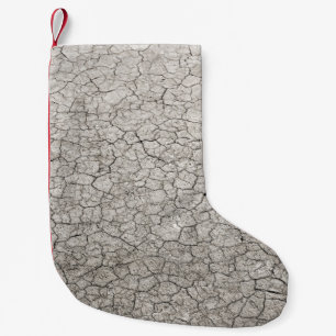 Global worming concept - cracked scorched earth so small christmas stocking