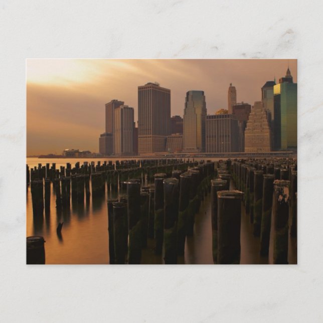 Glow of sunset during stormy skies over East Postcard (Front)