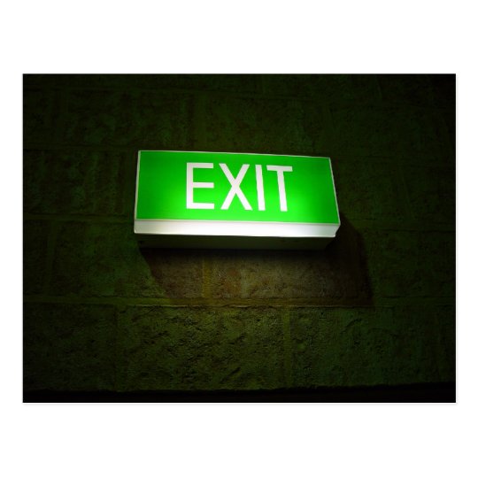 Glowing EXIT sign board on wall Postcard