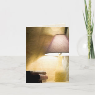 glowing lamp with old books impressionism card