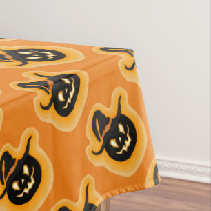 Glowing Pumpkin Witch On Orange Tablecloth
