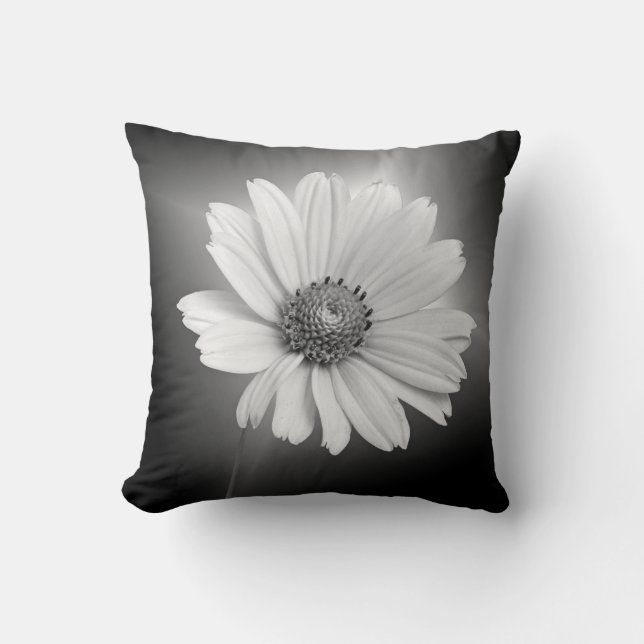 Glowing white daisy on black throw pillow (Front)