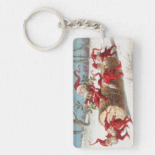 Gnomes dragging a cut tree trunk through the snow keychain