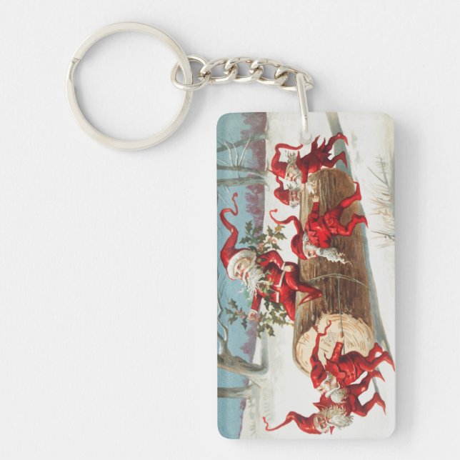 Gnomes dragging a cut tree trunk through the snow keychain (Front)