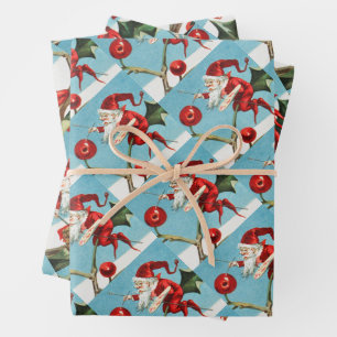 Gnomes painting holly berries in the snow wrapping paper sheet