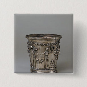 Goblet embossed with skeletons holding masks 2 inch square button