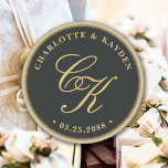 Gold Accent Dark Green Monogram Wedding Favour Classic Round Sticker<br><div class="desc">Elevate your wedding favours to a whole new level of charm with our Gold Accent Dark Green Monogram Round Stickers! These exquisite stickers showcase a stunning script monogram of the happy couple, delicately entwined, and placed against a deep sage green backdrop. The timeless gold frame surrounding the design adds a...</div>