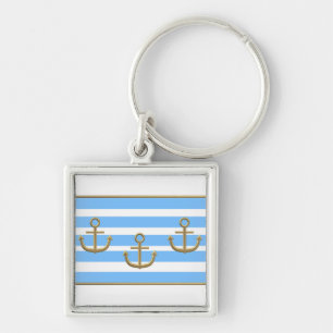 gold anchor blue white background keychain