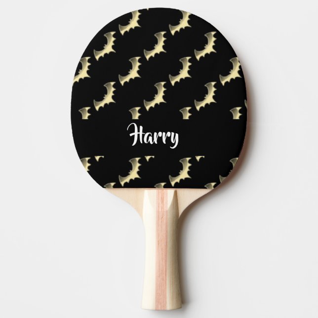 Gold bats on black ping pong paddle (Front)