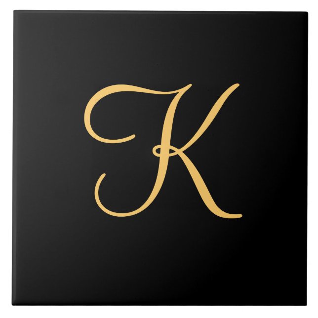 Gold-coloured initial K on black background Tile (Front)