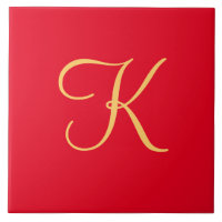 Gold-coloured initial K on solid red background