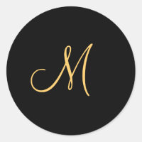 Gold-coloured initial M on black monogram  round