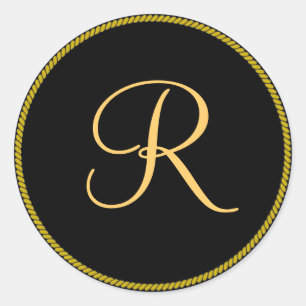 Gold-coloured initial R on black monogram sticker