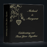 Gold Elegant Heart Wedding Anniversary Binder<br><div class="desc">Elegant design featuring a heart pendant and swirls in a light gold colour on a black background. Fully customizable for your own special occasion - perfect for any anniversary. Visit the store to see the collection of gifts and paper products featuring this romantic design. sgb01</div>