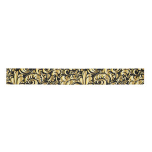 Gold flourish on black satin ribbon
