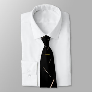 gold flutes on black tie
