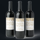 Gold Foil Effect Typography Merry Christmas Wine Label<br><div class="desc">Decorate your Christmas party this holiday season with these unique and modern Christmas bottle labels. The design features a festive gold foil effect typography script "Merry Christmas" with matching hanging foliage on a clean white background. Easily add your custom wording to these holiday labels by using the "Edit this design...</div>
