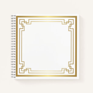Gold frame on white notebook