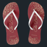 Gold Frills Crimson Red Elegant The Bride Wedding Flip Flops<br><div class="desc">Dance the night away with these beautiful wedding flip flops. Designed for the bride, they feature a simple yet elegant design with gold coloured script lettering on a crimson red background and fancy golden lace curls and swirls. Beautiful way to stay fancy and appropriate while giving your feet a break...</div>