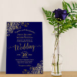 Gold Frills Elegant Navy Blue Wedding Invitation<br><div class="desc">This beautiful wedding invitation features a simple yet elegant design with lacy script calligraphy on a navy blue background and frilly gold faux foil filigree in the corners. The wording is formal,  but the layout is modern and stylish.</div>