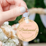 Gold Frills on Coral Peach Bridesmaid Wedding Gift Keychain<br><div class="desc">These keychains are designed to give as favours to bridesmaids in your wedding party. They feature a simple yet elegant design with a pale coral peach or light orange coloured background, gold script lettering, and a lacy golden faux foil floral border. The text says "Bridesmaid" with space for her name,...</div>