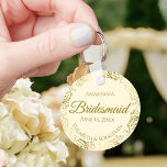 Gold Frills on Cream Bridesmaid Wedding Gift Keychain<br><div class="desc">These keychains are designed to give as favours to bridesmaids in your wedding party. They feature a simple yet elegant design with an ivory or cream coloured background, gold script lettering, and a lacy golden faux foil floral border. The text says "Bridesmaid" with space for her name, the names of...</div>