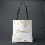 Gold Frills on White Elegant Bridesmaid Wedding Tote Bag<br><div class="desc">These Bridesmaid tote bags are designed as favours or gifts for wedding bridesmaids. Great swag bag to fill with favours and gifts. Coordinates with our Gold Foil Elegant Wedding Suite and is fully customizable. Simple design includes gold script text with a floral border over a white background. All text is...</div>