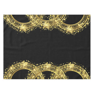 Gold Glitter Confetti in the Round on Black Tablecloth