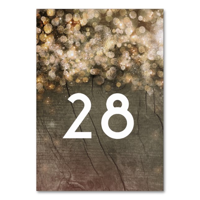Gold Glitter Lights Rustic Wood Barn Wedding Table Number (Front)
