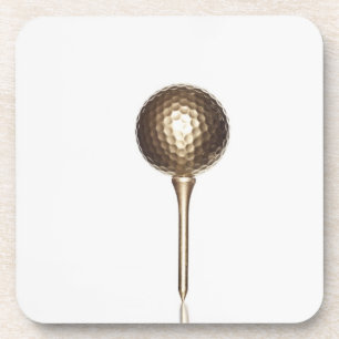 Gold golf ball and tee coaster