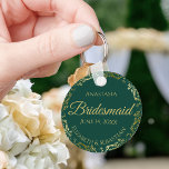 Gold Lace Bridesmaid Wedding Gift Emerald Green Keychain<br><div class="desc">These keychains are designed to give as favours to bridesmaids in your wedding party. They feature a simple yet elegant design with an emerald green background,  gold lettering,  and a golden faux foil floral lace border. Perfect way to thank your bridesmaids for being a part of your special day!</div>