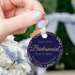 Gold Lace Bridesmaid Wedding Gift Navy Blue Keychain<br><div class="desc">These keychains are designed to give as favors to bridesmaids in your wedding party. They feature a simple yet elegant design with a navy blue background,  gold lettering,  and a golden faux foil floral lace border. Perfect way to thank your bridesmaids for being a part of your special day!</div>