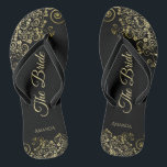 Gold Lace on Black The Bride Elegant Wedding Flip Flops<br><div class="desc">Dance the night away with these beautiful wedding flip flops. Designed for the bride, they feature a simple yet elegant design with gold coloured script lettering on a classic black background and fancy golden lace curls and swirls. Beautiful way to stay fancy and appropriate while giving your feet a break...</div>