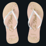 Gold Lace on Coral Peach The Bride Elegant Wedding Flip Flops<br><div class="desc">Dance the night away with these beautiful wedding flip flops. Designed for the bride, they feature a simple yet elegant design with gold coloured script lettering on a light orange or coral peach coloured background and fancy golden lace curls and swirls. Beautiful way to stay fancy and appropriate while giving...</div>