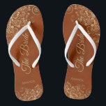 Gold Lace on Rust Orange Elegant The Bride Wedding Flip Flops<br><div class="desc">Dance the night away with these beautiful wedding flip flops. Designed for the bride, they feature a simple yet elegant design with gold coloured script lettering on a rust orange or burnt umber coloured background and fancy golden lace curls and swirls. Beautiful way to stay fancy and appropriate while giving...</div>