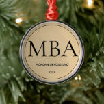 Gold MBA Graduation Metal Ornament<br><div class="desc">An ornament for the MBA graduate with a gold tone (non-foil) and black colour scheme. It shows the degree, name, and year. Simply customize this ornament, add it to your cart, and have a keepsake of this major achievement. Gold MBA Graduation Metal Ornament Holidayday Design | ©Melissa Patton - Designer...</div>