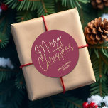 Gold Merry Christmas Cranberry Classic Round Sticker<br><div class="desc">Merry Christmas in a faux gold foil script and your names in chic lettering,  these cranberry red stickers are stylish for any Christmas holiday occasion. MORE COLORS and matching products in our collection.</div>