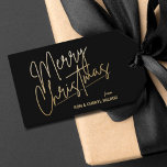 Gold Merry Christmas Luxe Black Gift Tags<br><div class="desc">Merry Christmas in a faux gold foil script and your names in chic lettering,  these black gift tags or party favour tags are stylish for any Christmas holiday occasion.</div>