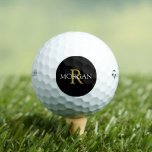 Gold Monogram & White Name on Black Circle Golf Balls<br><div class="desc">Personalize your monogram in gold and name In white on black circle.</div>