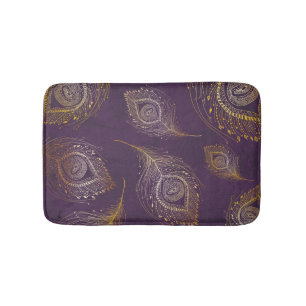 Gold peacock feather, violet background. bath mat