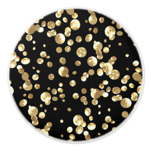 Gold polka dots on a black background . ceramic knob