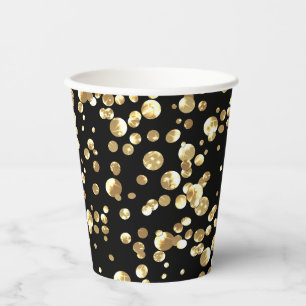 Gold polka dots on a black background . paper plat cups