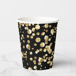 Gold polka dots on a black background . paper plat paper cups