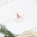 Gold Red Christmas Tree Return Name Address Classic Round Sticker<br><div class="desc">Gold Red Christmas Tree Return Name Address. Contemporary style for your festive mailings with Merry Christmas is in a stylish set handwritten style script beneath a ribbon like simplistic tree illustration in festive red and gold. Your return name and address details, which you can easily personalise, are curved above and...</div>