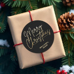 Gold Script Merry Christmas on Black Classic Round Sticker<br><div class="desc">Merry Christmas in a faux gold foil script and your names in chic lettering,  these black stickers are stylish for any Christmas holiday occasion. MORE COLORS and matching products in our collection.</div>