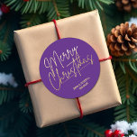 Gold Script Merry Christmas on Purple Classic Round Sticker<br><div class="desc">Merry Christmas in a faux gold foil script and your names in chic lettering,  these purple stickers are stylish for any Christmas holiday occasion. MORE COLORS and matching products in our collection.</div>