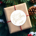Gold Script Merry Christmas on White Classic Round Sticker<br><div class="desc">Merry Christmas in a faux gold foil script and your names in chic lettering,  these white stickers are stylish for any Christmas holiday occasion. MORE COLORS and matching products in our collection.</div>