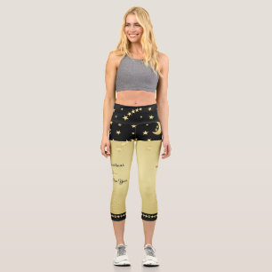 Gold shiny Christmas stars, paws on gold & black Capri Leggings