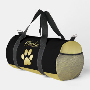 Gold Shiny Dog Paw on black background Duffle Bag
